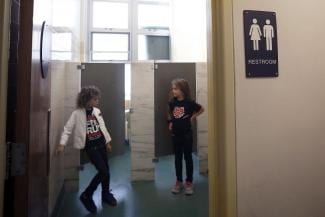 First grade twins Ari Braverman (left), and Ella Braverman (right), both 6 years old, show first grade gender neutral bathrooms at Miraloma Elementary school in San Francisco, Calif., on Wednesday, September 2, 2015. Photo: Liz Hafalia, The Chronicle styles medium public images blog posts Adam