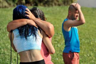 Friends and family members embrace outside the Orlando Police Headquarters after the Pulse Orlando nightclub mass shooting. Photo: Reuters styles medium public images blog posts Adam Dupuis 2016 06 12 florida shooting