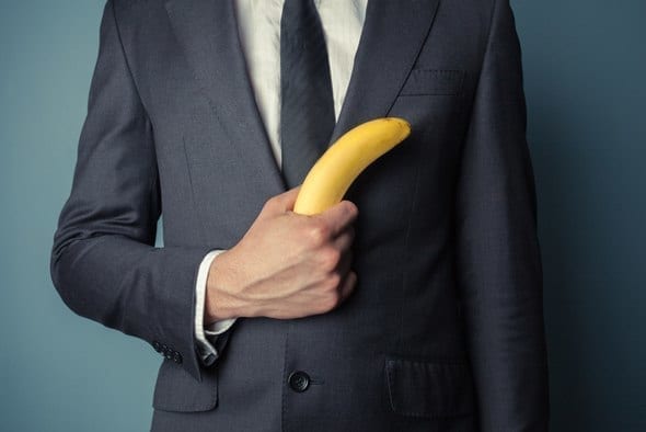 man-in-suit-holding-a-banana.jpg