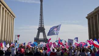 Demonstrators wave flags at Trocadero plaza to protest gay marriage in Paris, Sunday, Oct. 16, 2016. Thousands of people have marched in Paris to call for the repeal of a law allowing gay marriage, six months before France's next presidential election. (AP Photo) styles medium public images blog posts Adam Dupuis 2016 10 16 parisgaymarriageprotest