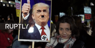 Anti-Trump rallies have been all over. This one was in London where pro-Trump supporters were escorted away (news.com.au screen shot). styles medium public images blog posts Adam Dupuis 2016 11 29 Screen Shot 2016 11 29 at 10.32.54 AM