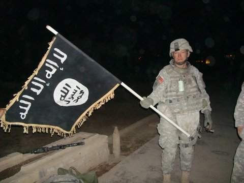 styles large public images blog posts Devin Randall 2018 01 03 U.S. Army soldier with captured ISIS flag in Iraq December 2010