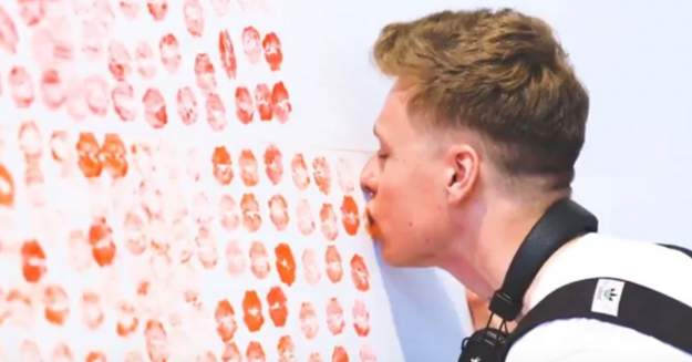 Screenshot via Youtube styles large public images blog posts Devin Randall 2018 07 05 heathrowairport kissrainbowflag