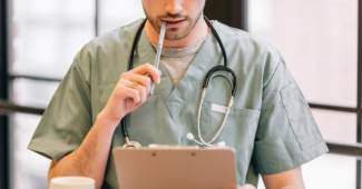 styles medium public images blog posts Adam Dupuis 2018 12 03 doctor looking at clipboard 4460x4460 2